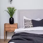Explore The City From Its Center In A Chic Balcony Apartment